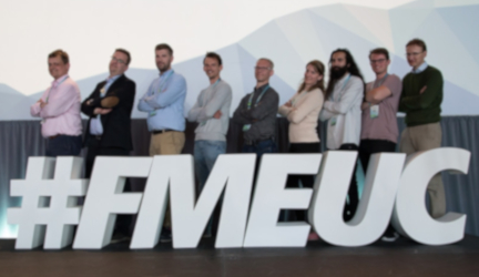 Group of people infront of FMEUC sign